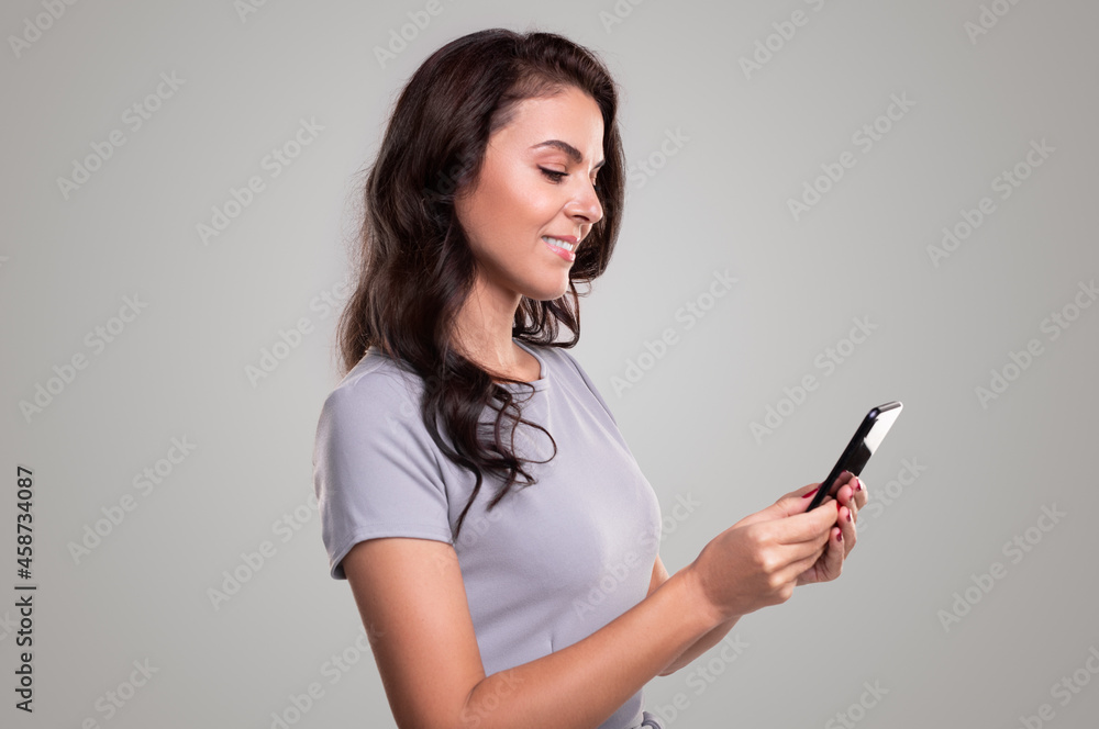 Positive adult businesswoman using smartphone Positive adult businesswoman using smartphone