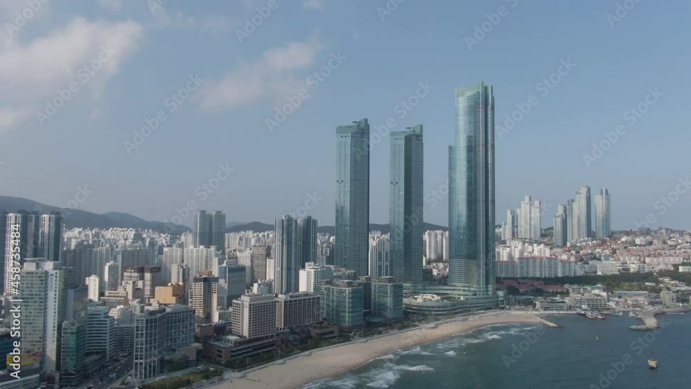 Aerial view of Haeundae beach in the Busan. Skyscraper and Haeundae beach. May, 2021. 부산, 초고층빌딩, 해운대 해수욕장. Aerial view of Haeundae beach in the Busan. Skyscraper and Haeundae beach. May, 2021. 부산, 초고층빌딩, 해운대 해수욕장.