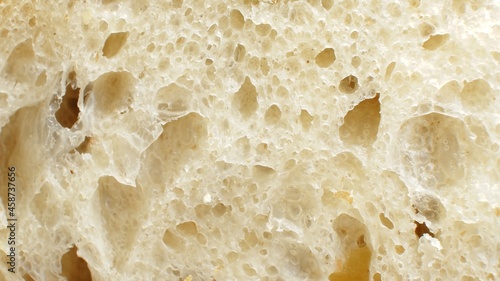Close up of an airy porous bread slice