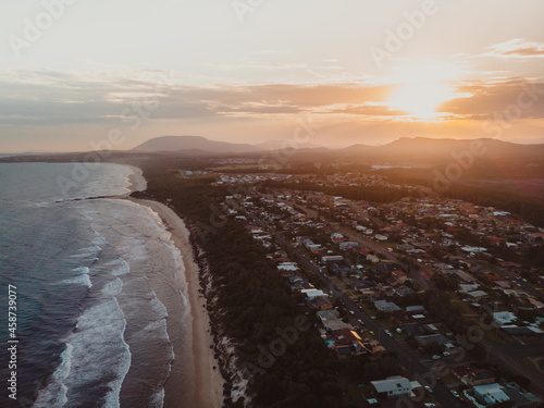 Sunset over the beachfront properties at Lake Cathie photo