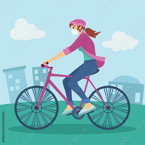 Woman wearing medical mask riding a bicycle in the city