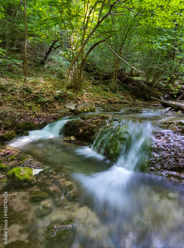 beautiful waterfall in the mountain forest