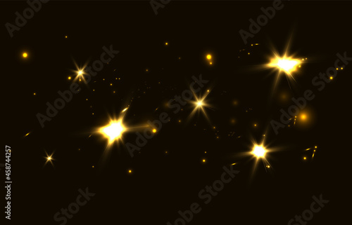 Shining bokeh isolated on black background. Gold lights glare Christmas glow. © MAKSYM