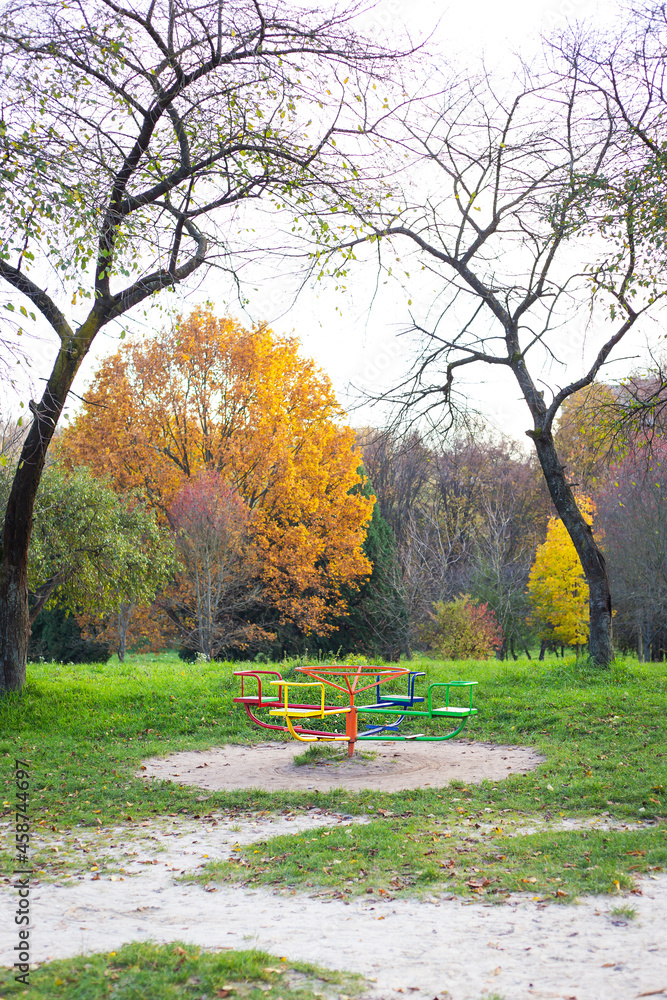 A bright playground surrounded by greenery, many different swings, a beautiful and cozy park for relaxation. A bright playground surrounded by greenery, many different swings, a beautiful and cozy park for relaxation.