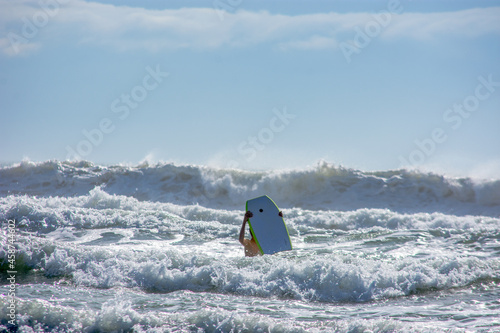 Surfer in rough water