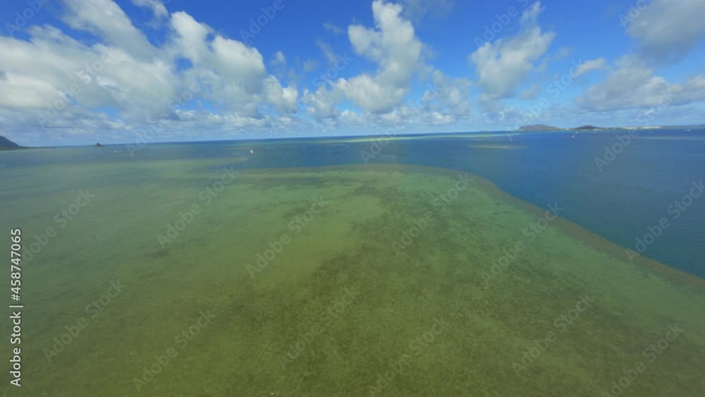 Coral Reef of the Pacific, Blue Green Sparkling Water Below and Fluffy Summer Clouds Above Coral Reef of the Pacific, Blue Green Sparkling Water Below and Fluffy Summer Clouds Above