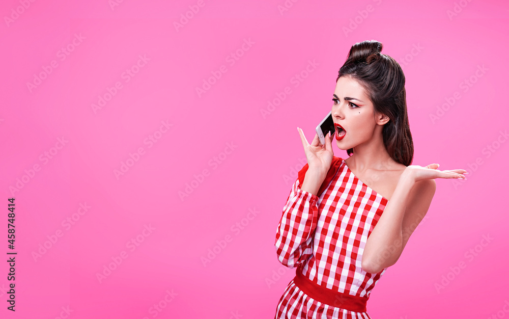 Beautiful young brunette dressed in retro style argues on the phone Beautiful young brunette dressed in retro style argues on the phone