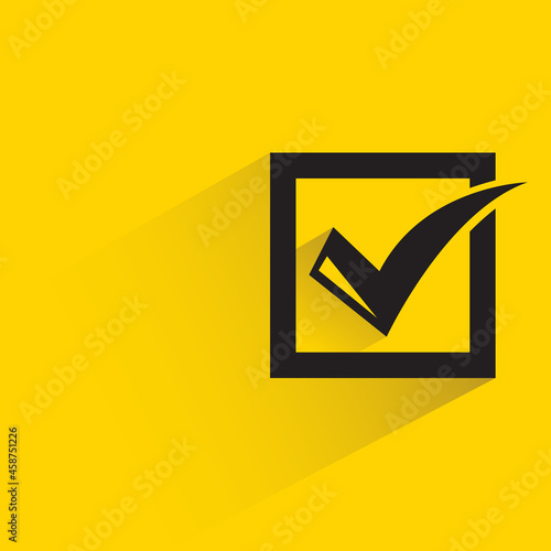 check mark with shadow on yellow background