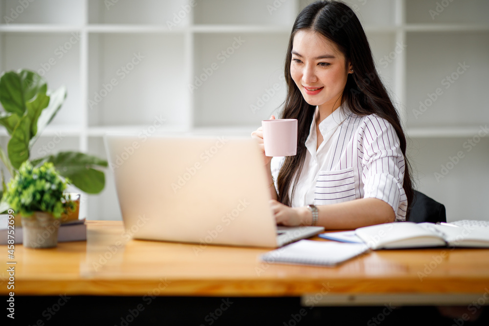 Portrait of a smiling Asian businesswoman in the office. Portrait of a smiling Asian businesswoman in the office.