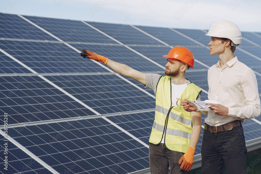 Foreman and businessman at solar energy station. Foreman and businessman at solar energy station.