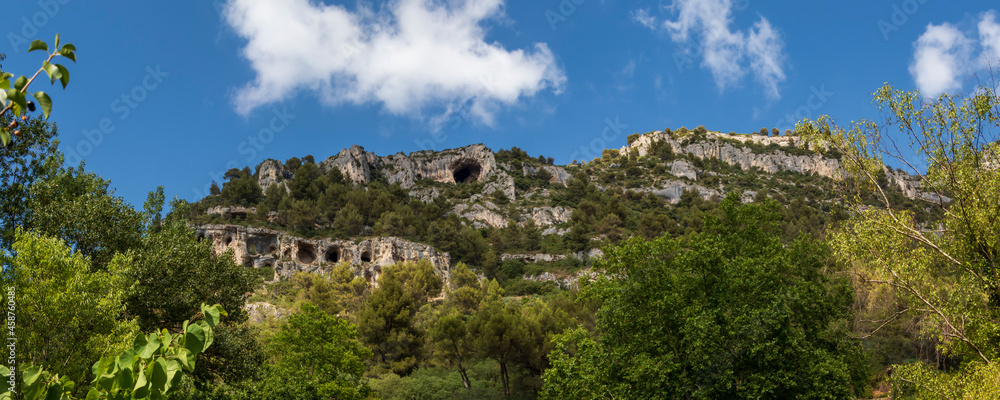 Mountain cliffs with caves in Fontaine-de-Vaucluse, Provence, France