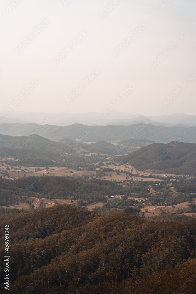 Landscape with hazy mountain views behind a valley in regional New South Wales. Landscape with hazy mountain views behind a valley in regional New South Wales.