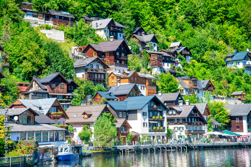 Amazing beautiful town of Hallstatt in sumemr season, Austria. Homes over the lake.
