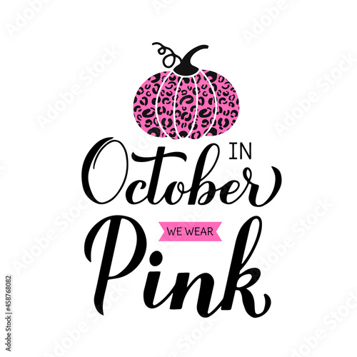 In October we wear pink lettering with pumpkin. Breast cancer awareness month quote. Vector template for typography poster, banner, flyer, sticker, etc