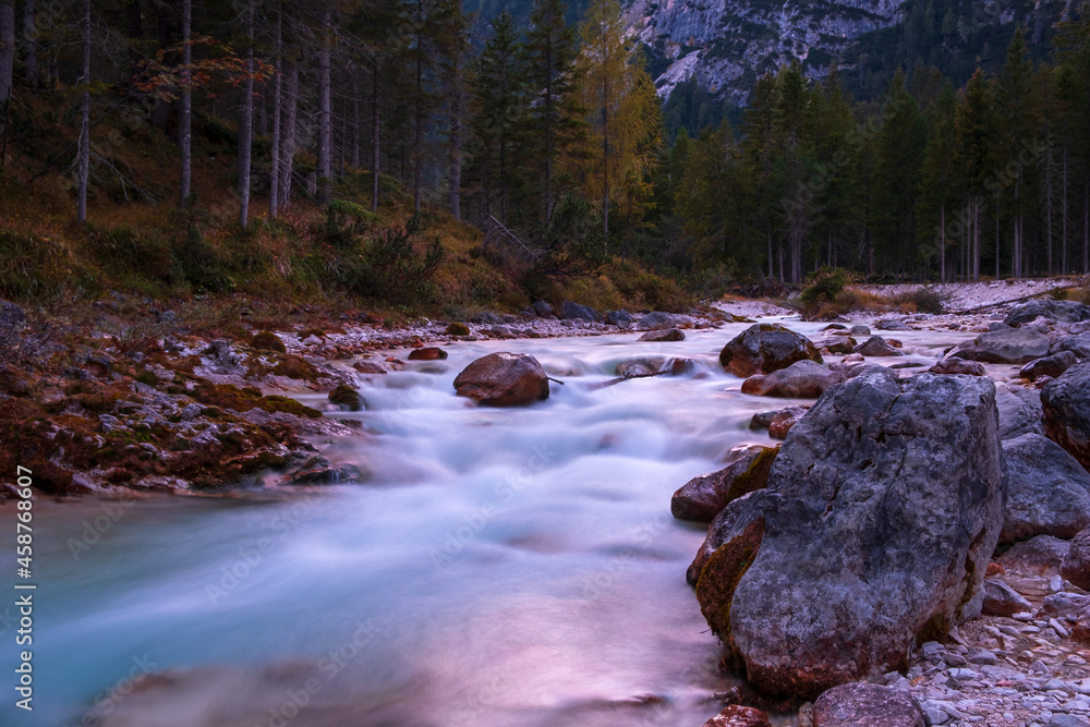 Mountain stream at sunset near Passo Giau, near Cortina d’Ampezzo Mountain stream at sunset near Passo Giau, near Cortina d’Ampezzo