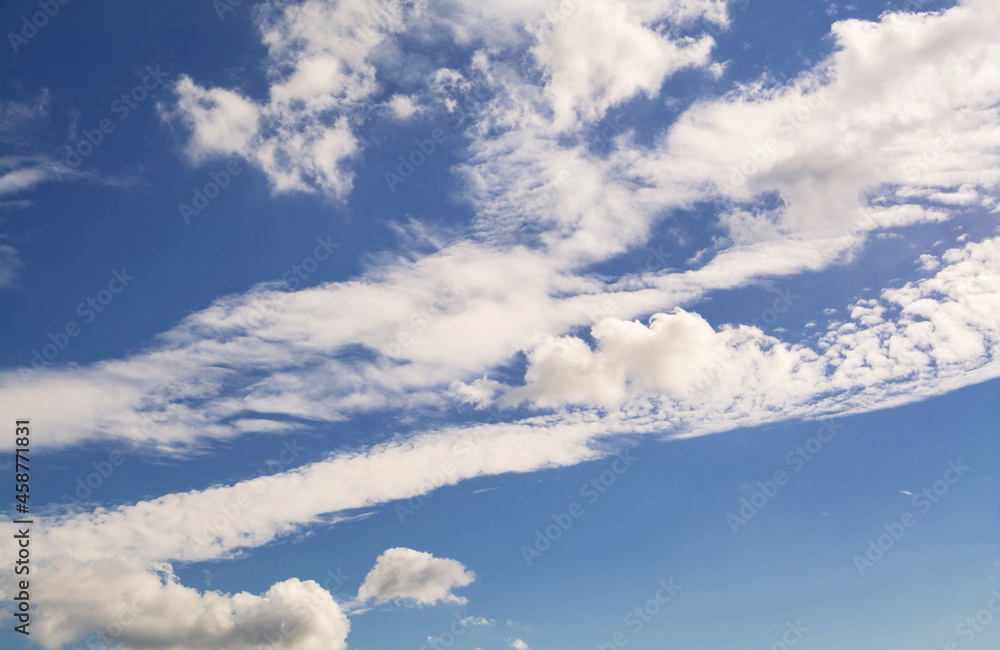 Beautiful white fluffy clouds on a blue sky background Beautiful white fluffy clouds on a blue sky background