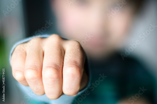 Selective focus of a child's fist