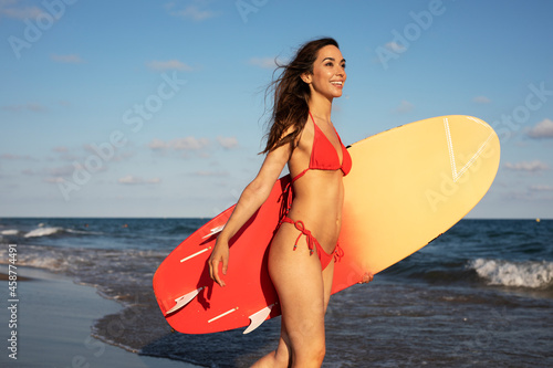  Beautiful woman with surfboard. Hot beautful girl preparing for the surf