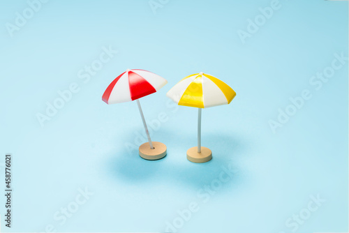 Wallpaper Mural Yellow and red umbrella on a blue background. Torontodigital.ca