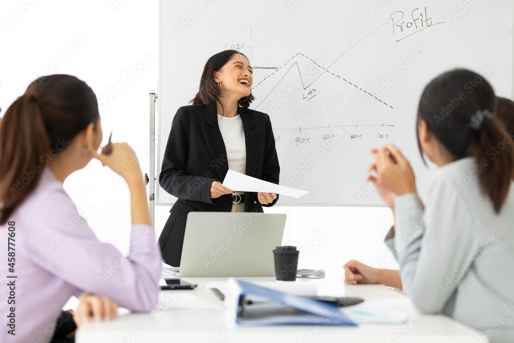 young businesswoman seminar or meeting and presentation about work project on whiteboard