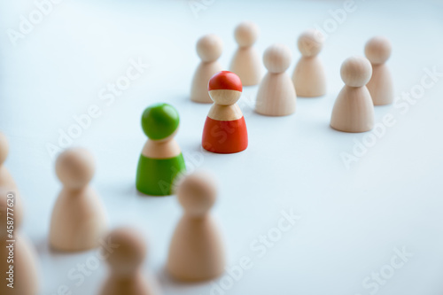 Red and green wooden figures teams against opponent or enemy. Strategy  Conflict  management  business planning  tactic  politic  communication and leader concept
