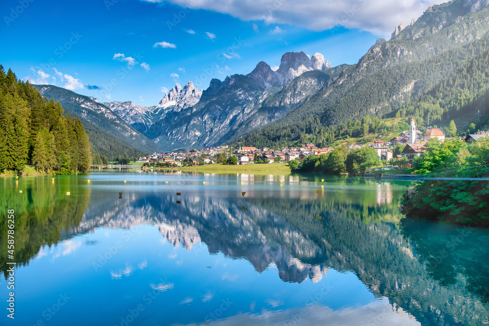 Auronzo Lake and town in summer season, Italian Alps.