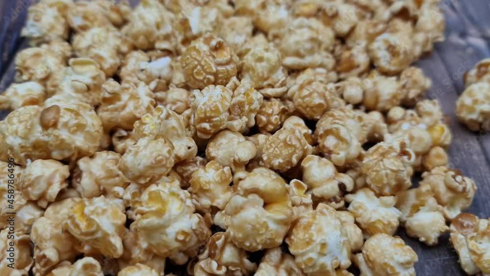 The Fresh hot natural popcorn close-up. Fresh caramel corn. The Fresh hot natural popcorn close-up. Fresh caramel corn.