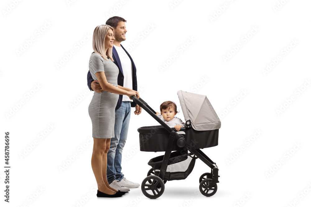 Full length profile shot of a young man and woman with a baby in a pushchair Full length profile shot of a young man and woman with a baby in a pushchair
