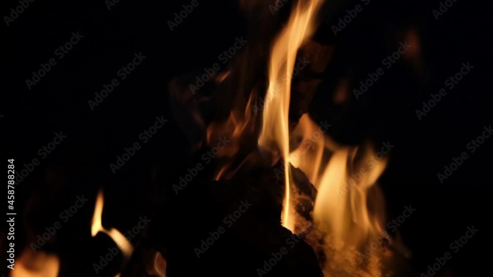 slow motion, a fire is burning in the night, you can see burning boards, the flame rises, sometimes you can see light smoke slow motion, a fire is burning in the night, you can see burning boards, the flame rises, sometimes you can see light smoke