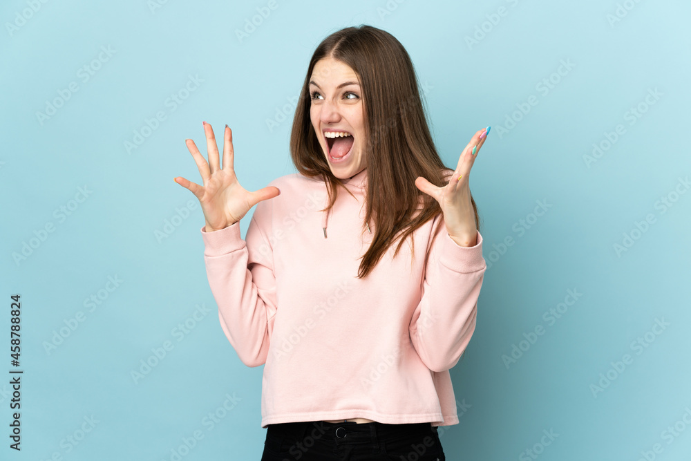 Young caucasian woman isolated on blue background with surprise facial expression Young caucasian woman isolated on blue background with surprise facial expression