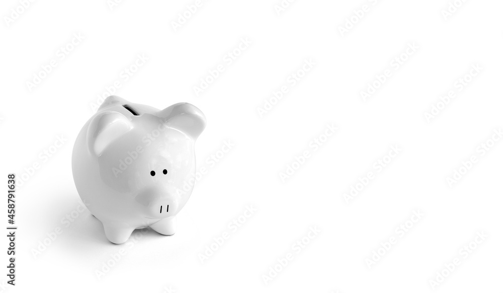 Piggy bank on white background to left side isolated with shadow