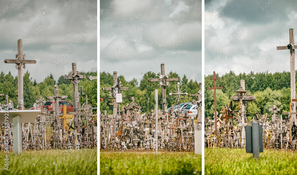 SIAULIAI, LITHUANIA - JULY 9, 2017: Tourists and pilgrims visit Hill of Crosses. The Hill Of Crosses in northern Lithuania has been a site of pilgrimage for hundreds of years