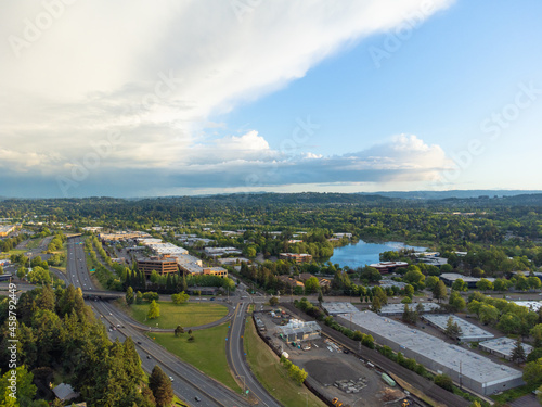 Small town, residential area. Lots of greenery. Large and small highways. Small lakes. Beautiful nature. View from above. Aerial photograph. Ecology, nature, advertising of tourist destinations. © Anton