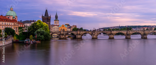 Famous Charles bridge in Prague during twilight.  