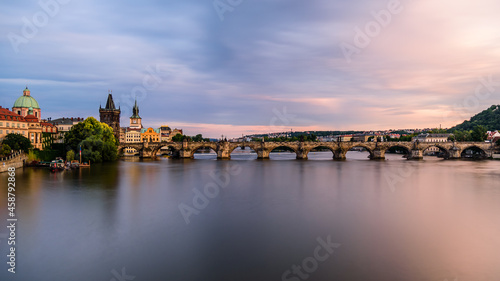 Famous Charles bridge in Prague during twilight. 