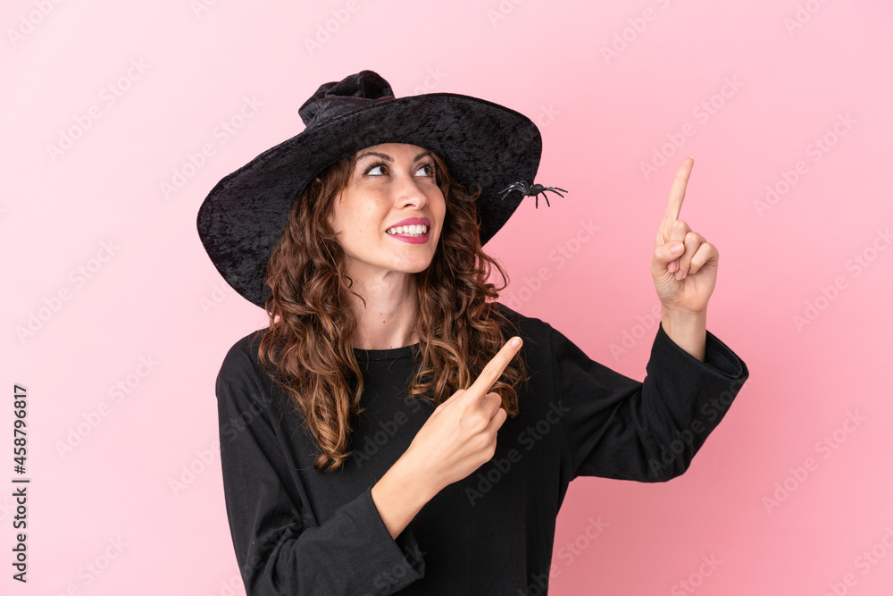 Young caucasian woman celebrating halloween isolated on pink background pointing with the index finger a great idea Young caucasian woman celebrating halloween isolated on pink background pointing with the index finger a great idea