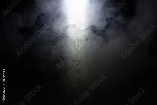 Light and shadow with white haze on a black and dark background. photo