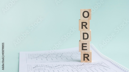 word order with wood building blocks, light green background