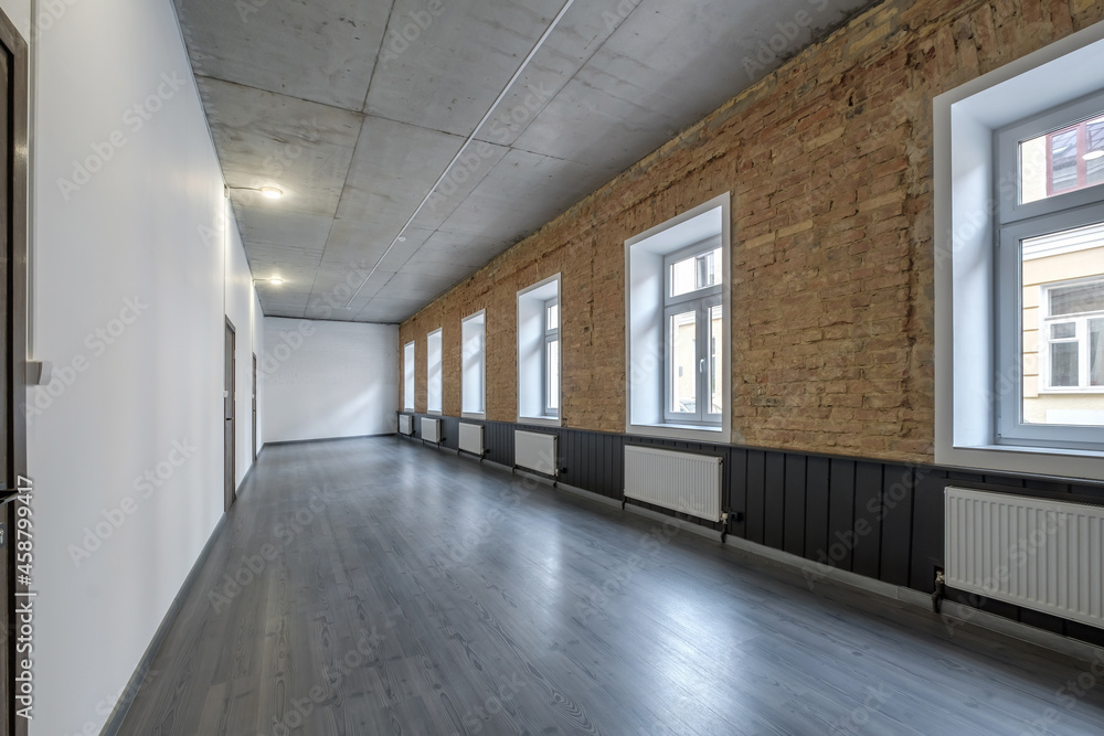 long white empty corridor in interior of entrance hall of modern apartments, office or clinic