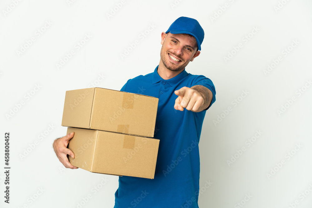 Delivery caucasian man isolated on white background pointing front with happy expression Delivery caucasian man isolated on white background pointing front with happy expression