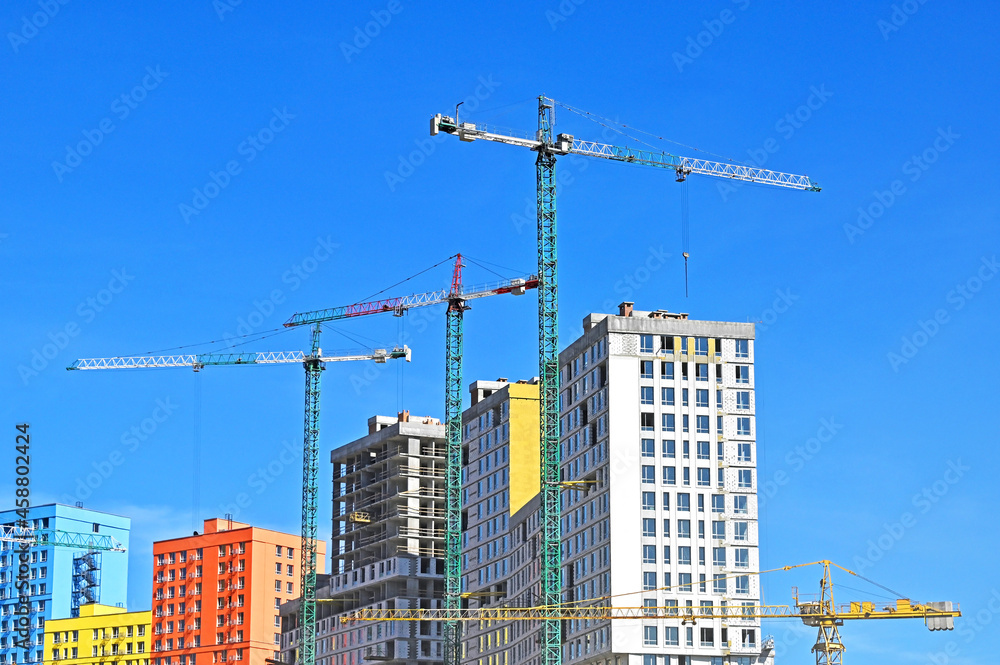 Crane and highrise construction site Crane and highrise construction site