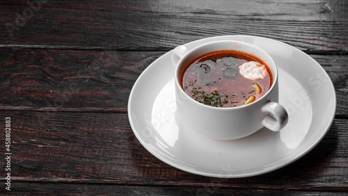 Slika na platnu Appetizing dish of russian hodgepodge soup in ceramic pot