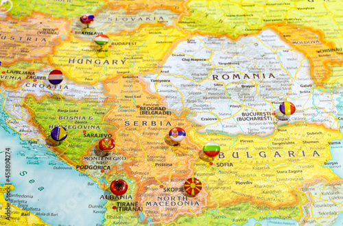 Close up view of Balkan peninsula on geographical globe, Map shows capitals countries Serbia - Belgrade, Bulgaria - Sofia, Romania - Bucharest, Montenegro - Podgorica. Albania - Tirana and their flags