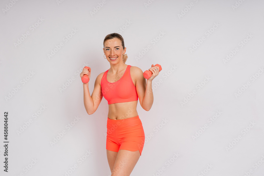 Attractive blonde caucasian smiling woman isolated on white, blue. Studio shot looking at camera Attractive blonde caucasian smiling woman isolated on white, blue. Studio shot looking at camera