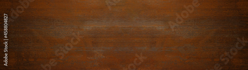 Grunge rusty dark orange brown weathered aged metal corten steel wall texture background banner panorama