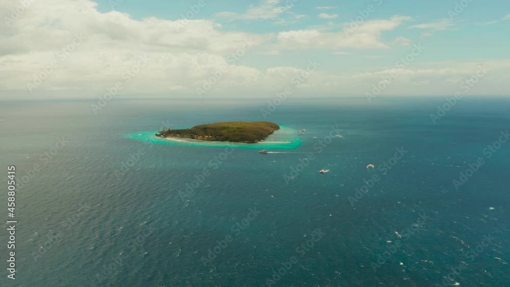 Tropical island with sandy beach in the blue sea, aerial view. Small island with sandy beach. Summer and travel vacation concept, Sumilon island, Philippines. Tropical island with sandy beach in the blue sea, aerial view. Small island with sandy beach. Summer and travel vacation concept, Sumilon island, Philippines.
