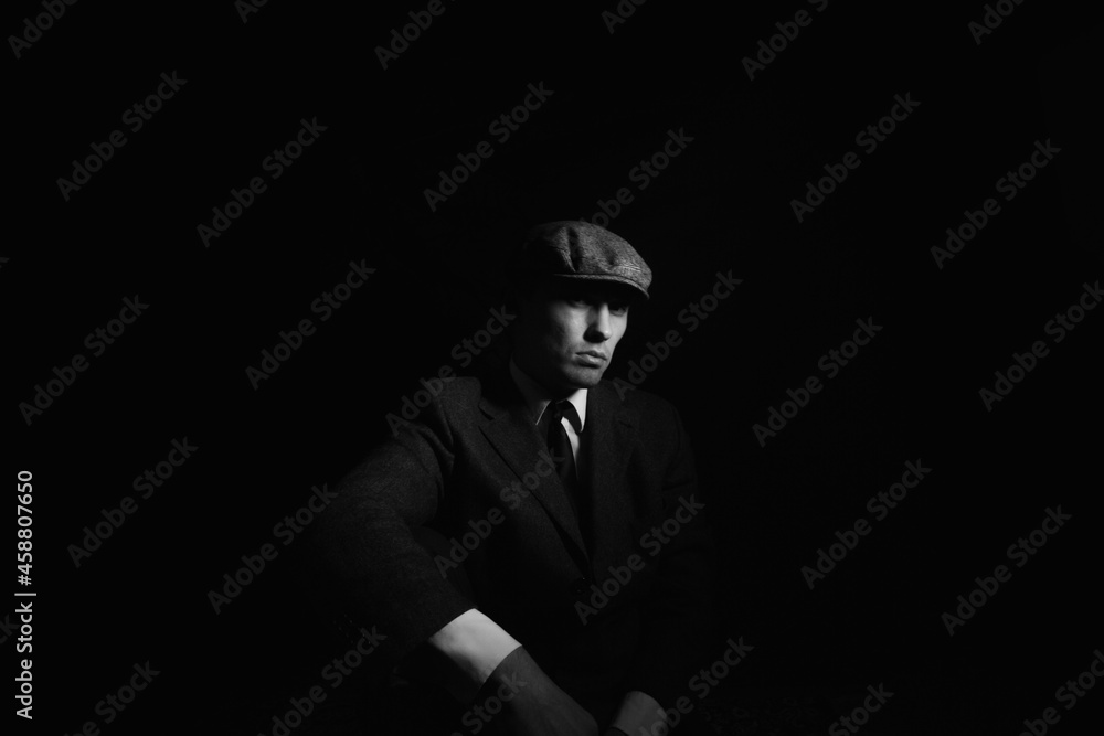 portrait of a man in the dark. black and white portrait portrait of a man in the dark. black and white portrait