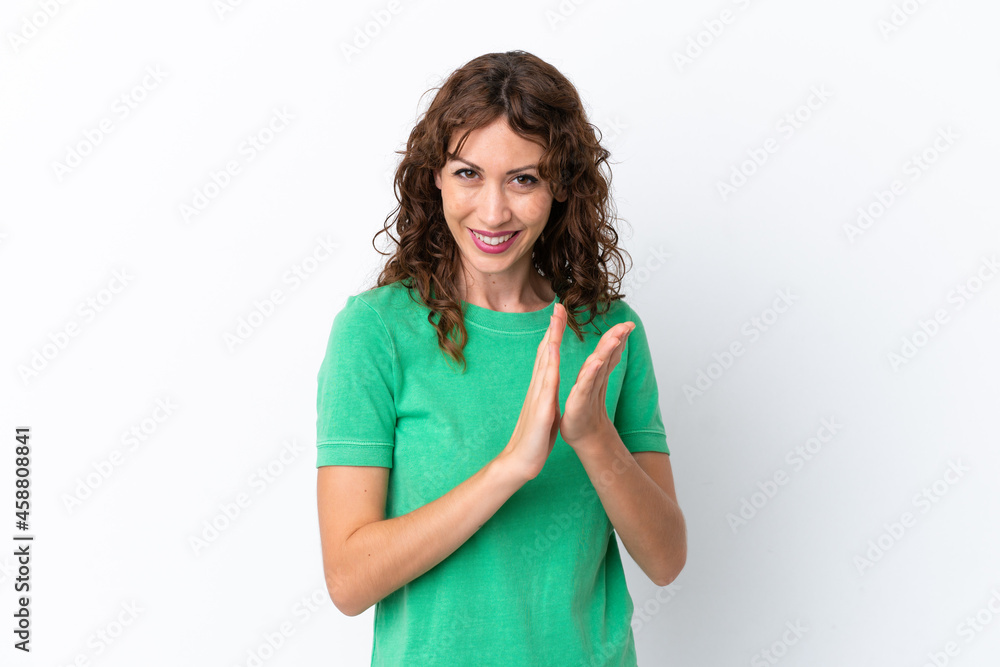 Young woman with curly hair isolated on white background applauding after presentation in a conference Young woman with curly hair isolated on white background applauding after presentation in a conference
