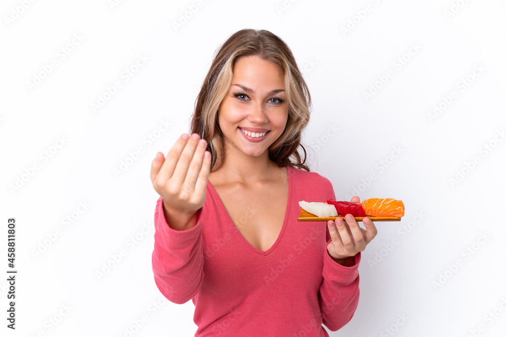 Young Russian girl holding sashimi isolated on white background inviting to come with hand. Happy that you came Young Russian girl holding sashimi isolated on white background inviting to come with hand. Happy that you came