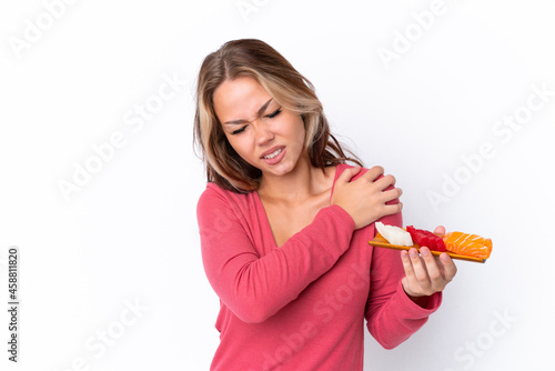 Young Russian girl holding sashimi isolated on white background suffering from pain in shoulder for having made an effort